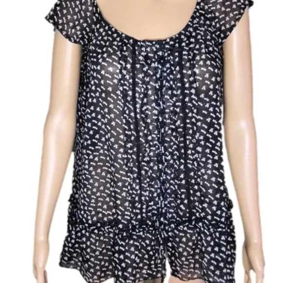 Black and white top. Size L. The brand is Fire and is 100% polyester. - Picture 2 of 4